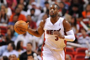 Nov 12, 2013; Miami, FL, USA; Miami Heat shooting guard Dwyane Wade (3) dribbles the basketball against the Milwaukee Bucks during the second half at American Airlines Arena. The Heat won 118-95. Mandatory Credit: Steve Mitchell-USA TODAY Sports